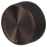 Mica Fluted progressive shower mixer with a round fluted control in Dusk bronze on a white background.
