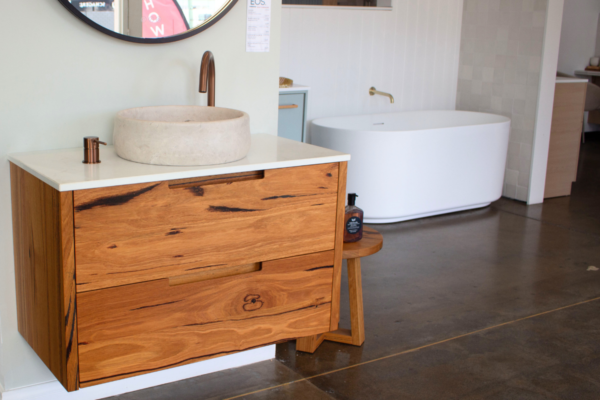 Timber vanity with twin round basins and backlit mirrors
