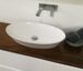 Ceres white ceramic oval counter top basin on timber benchtop