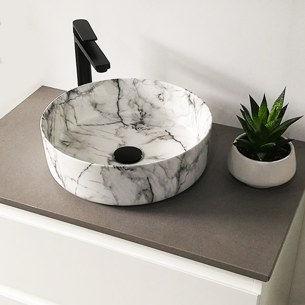 Eris Chich bench mount ceramic basin with marble veins