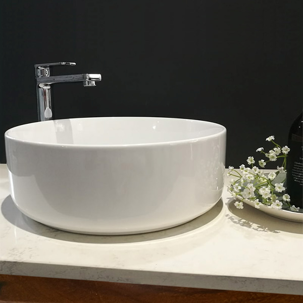 Front view Icarus bench mount ceramic basin